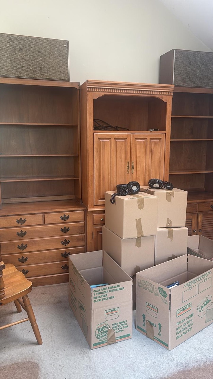 Sorting and packing household contents.