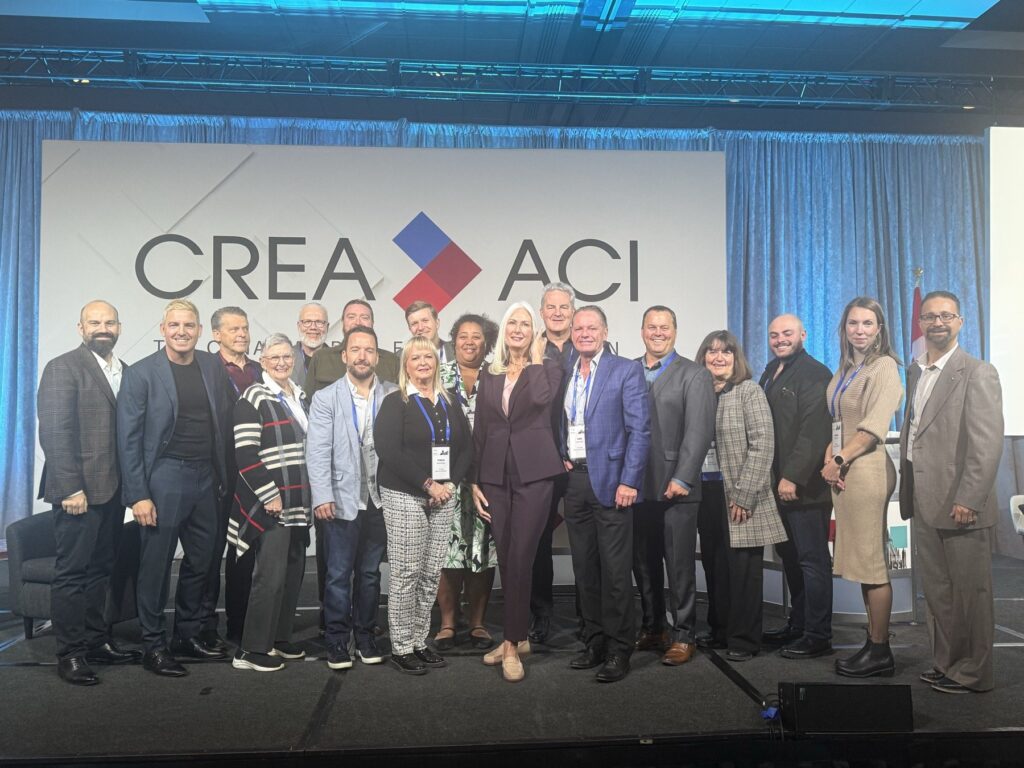 CREA PAC 2026 participants posing together on stage in front of the CREA logo