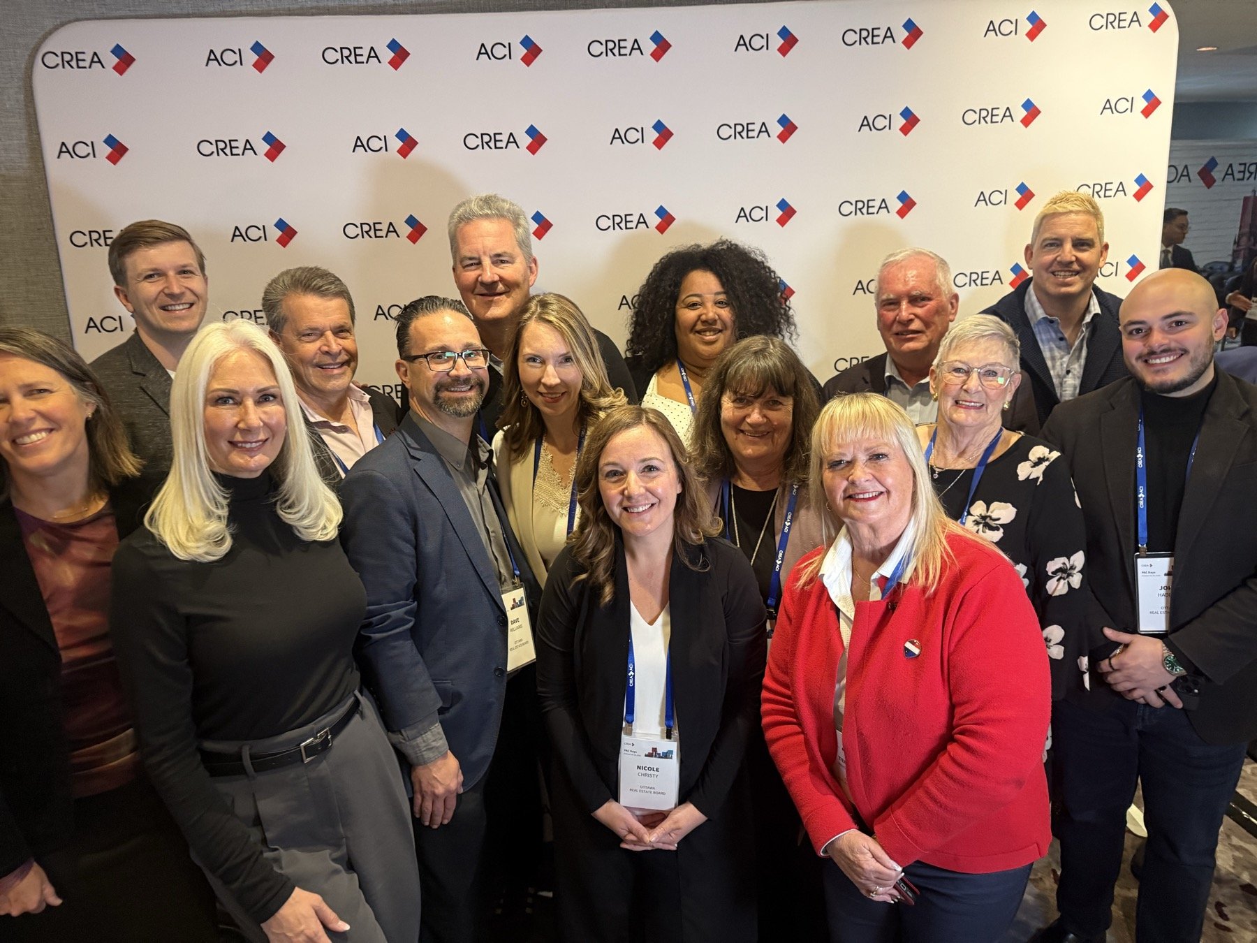 Participants gathered in front of a CREA backdrop during PAC Days 2026